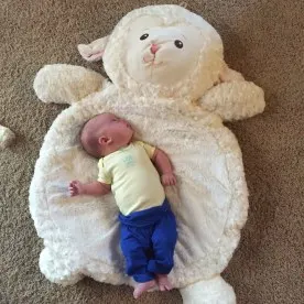 Baby with Down syndrome playing on BestEver Lamb Playmat