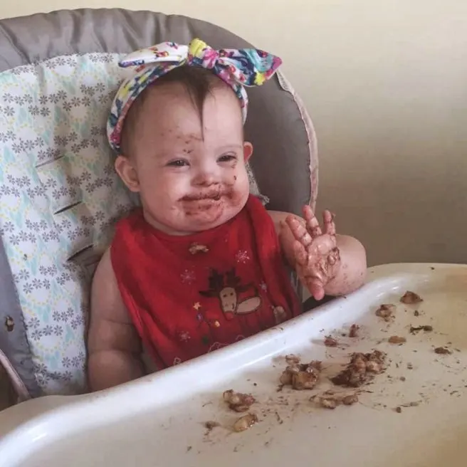 Kara eating some yummy banana and cinnamon for her snack